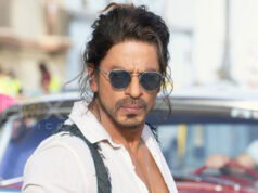 Shah Rukh Khan Top Grossers
A stylish man with sunglasses standing in front of a classic car on a city street, showcasing movie star charisma and urban fashion.