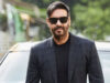 Ajay Devgn Top Grossers
Stylish man wearing black blazer and sunglasses standing outdoors next to a luxury car, showcasing celebrity lifestyle and movie star presence.