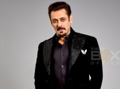 Salman Khan Top Grossers
Elegant man in black suit with a satin lapel and butterfly brooch, posing against a plain gray background, representing film and entertainment industry themes at Inside Box Office.