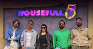 What You Need to Know About Akshay Kumar’s Next Movie Housefull 5 Brightly lit promotional image of the cast from the movie Housefull 5 standing in front of a signboard with the movie title, showcasing a fashionable and diverse group of actors promoting the latest Bollywood comedy film.