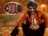 Everything about the Most Hyped Rajinikanth Upcoming Movie Coolie High-energy Indian movie poster featuring a charismatic actor in stylish attire and sunglasses, set in a lively, cluttered room with stacks of papers and bottles, emphasizing popular Bollywood entertainment.