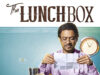 The Lunchbox Movie Review: A Heartfelt Tale of Love Loneliness & Unexpected Connections
A man enjoying a meal while reading a letter, with a clock in the background, represents the comedy-drama film "The Lunchbox," highlighting themes of food, time, and storytelling.