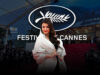 Aishwarya Rai at Cannes 2025: Where Fashion Becomes a Statement Elegant woman at Cannes Film Festival red carpet, with iconic Cannes logo and bustling event atmosphere, showcasing film industry glamour and celebrity presence in front of a modern venue.