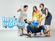 Hey Prabhu!” To “Oh Prabhu!” – Why This Mx Player Web Series Deserves Your Binge Watch Weekend Overwhelmed Group Of Women Arguing With Man Lying On The Floor, Humorous Scene From Bollywood Comedy &Quot;Hey Prabhu&Quot; Featuring Dramatic Expressions And A Modern Indoor Setting.