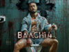 Baaghi 4 Day Wise Detailed Box Office Collection | India and Overseas Blood-splattered man sitting on a toilet with a knife and a bottle of alcohol in a gruesome, horror-themed setting from the movie "BACH 4".