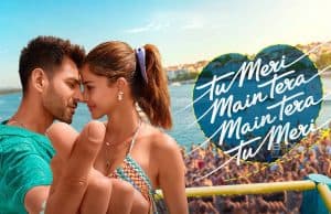 An Entertainer But Overdramatic | Kartik Aaryan’s Tu Meri Main Tera Main Tera Tu Meri Review 2025 Romantic Scene Of A Young Couple At The Beach, Embracing Close With Their Foreheads Touching During Sunset, Capturing Love And Happiness In A Lively Summer Setting.