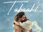 Toxic New Song Tabaahi Review: Disappointment From Yash Starrer Continues An Intense Scene From The Indian Action Thriller Film &Quot;Tabahi&Quot; Featuring A Man And Woman Embracing Each Other Against A Cloudy Sky Background.